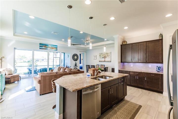 TOTALLY OPEN FLOOR PLAN. FRESHLY PAINTED WITH A FLORIDIAN LOOK. SIMPLY BEAUTIFUL.