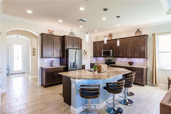 BEAUTIFUL & BRIGHT. NOTE THE UPGRADED 12X24 PLANK FLOORING & THE TALL ARCHWAYS & DOORS THROUGHOUT THE HOME.