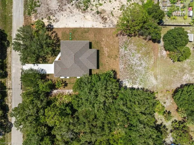 Drone view over roof. Notice all roof slopes are gable free giving you a hip roof design which is preferred by Florida Insurance Companies to give lower rates.