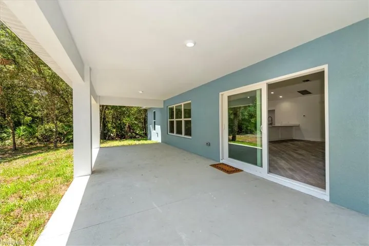 Another view of the large rear lanai 28 x 12. The triple windows is where the dining area is located. All the windows are impact double pane insulated glass. So optimal storm protection without the need for shutters.