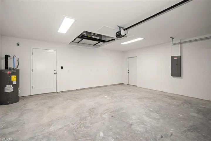 The garage is 20 x 22 which you will notice the HVAC system is recessed in the ceiling to keep it out of the way giving more space in the garage and easy access for maintenance. The side door is nice to have as well for easy access and increase the airflow when you need some fresh air.