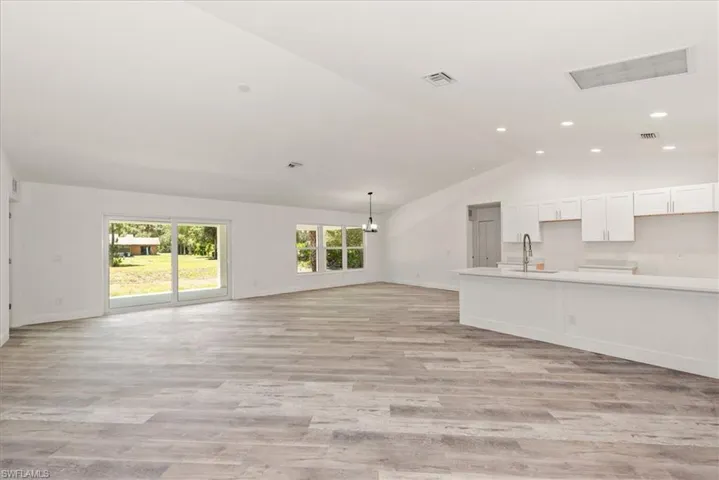 View from the entry which boasts vaulted ceilings and a excellent open floor plan.