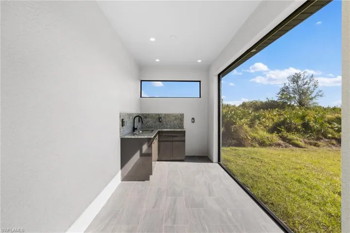 View of patio / terrace featuring sink and exterior kitchen