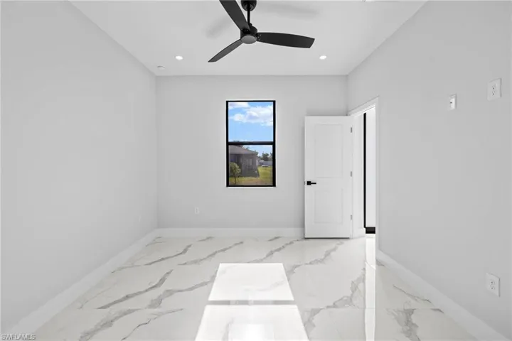 Empty room featuring ceiling fan