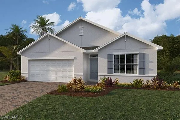 View of front of home with a garage and a front lawn