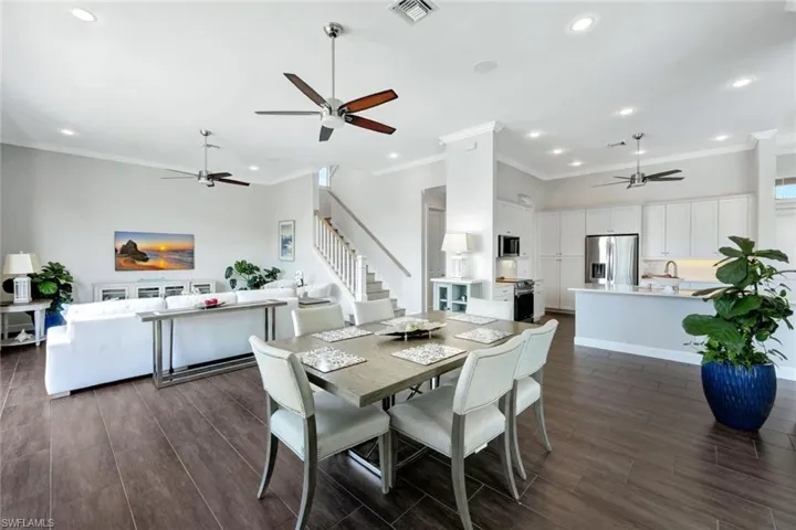 Dining space featuring ornamental molding and ceiling fan