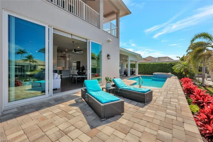 View of pool featuring an in ground hot tub and a patio area