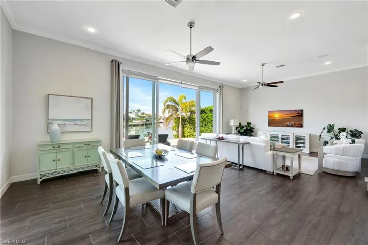 Dining area featuring crown molding and ceiling fan
