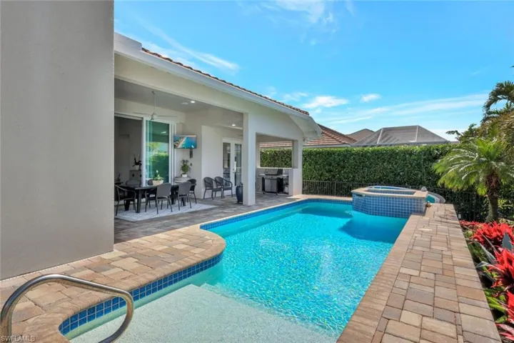 View of pool featuring an in ground hot tub and a patio area