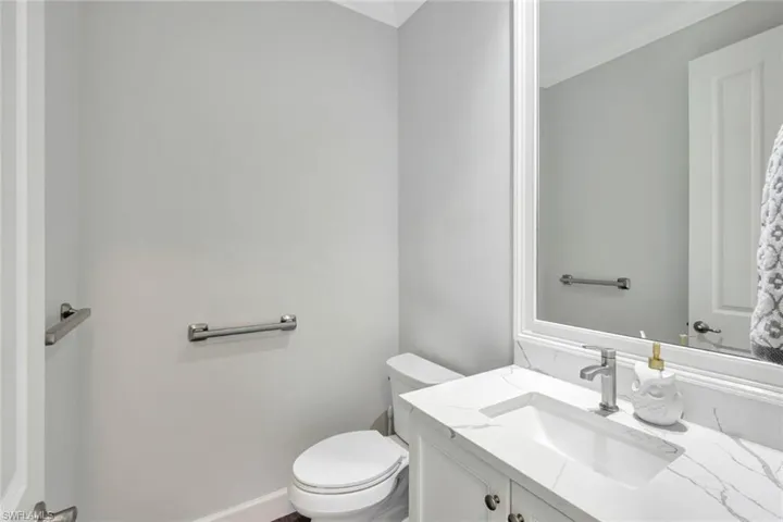 Bathroom featuring vanity and toilet