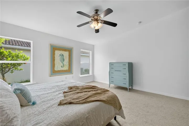 Bedroom featuring carpet and ceiling fan