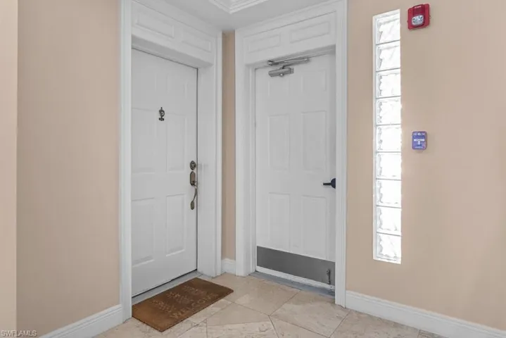 Foyer featuring baseboards