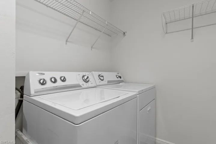 Laundry room with laundry area and washing machine and dryer