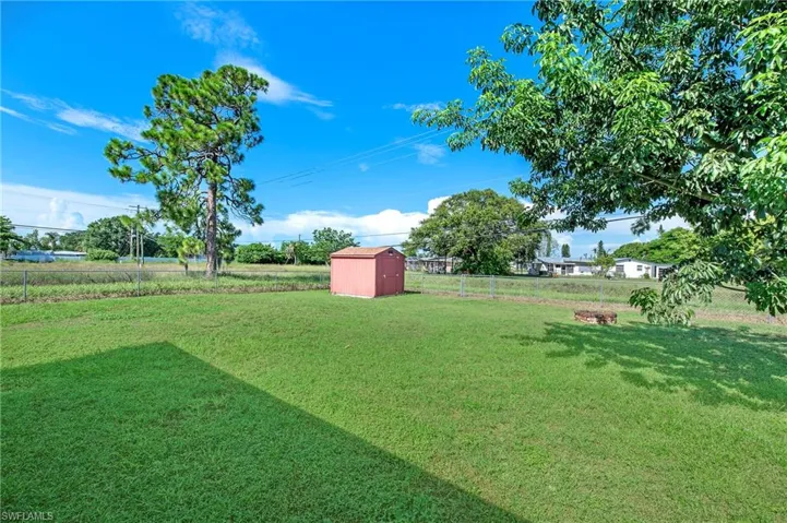View of yard with a storage shed