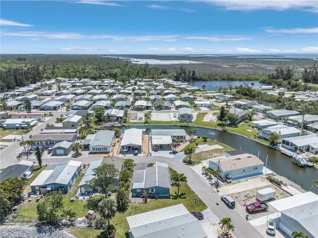 Aerial view featuring a water view and a residential view