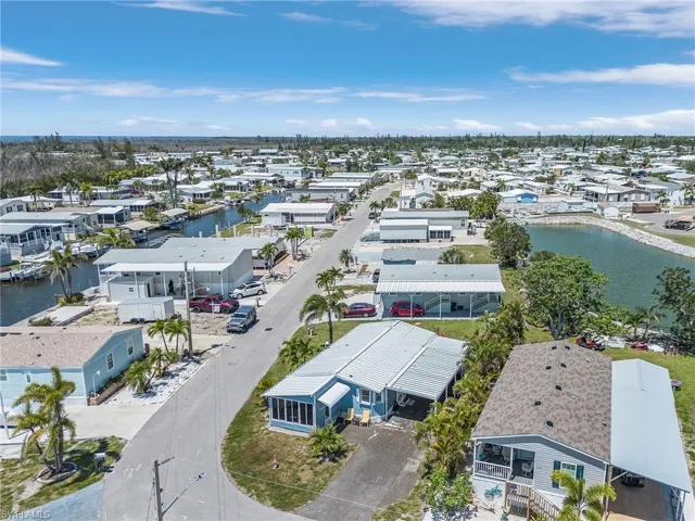 Drone / aerial view with a water view and a residential view