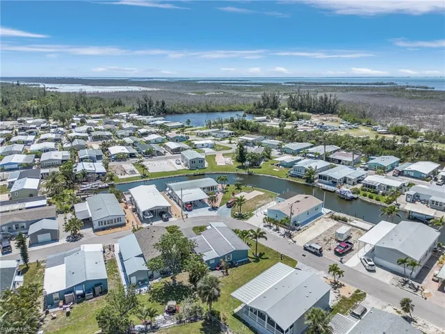 Birds eye view of property featuring a residential view and a water view