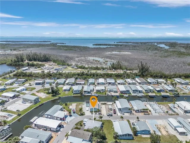Bird's eye view featuring a water view and a residential view
