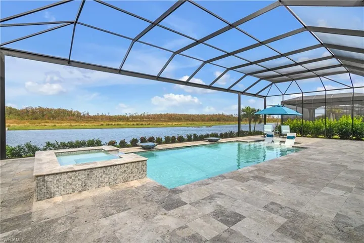 The heated pool is inviting and well-appointed with upgraded tile, overflowing fountain bowls, a spa, sunshelf, saltwater filtration and automatic filling system.