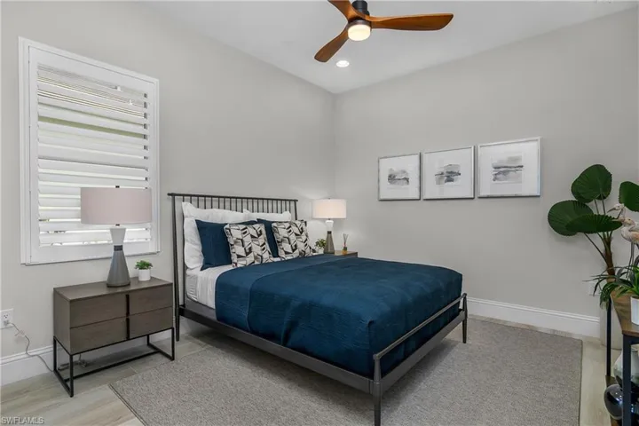 Guest bedroom with entry to pool and bath.