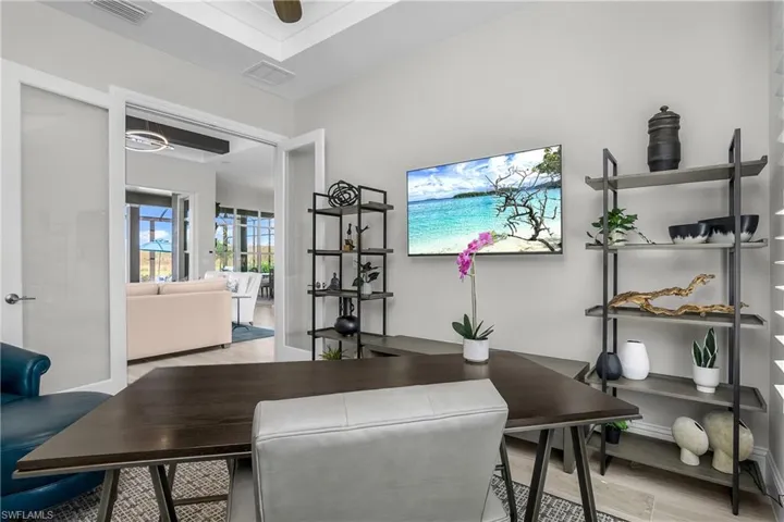 So much Natural Light! Work from home in your home office with french doors-located just off the great room.