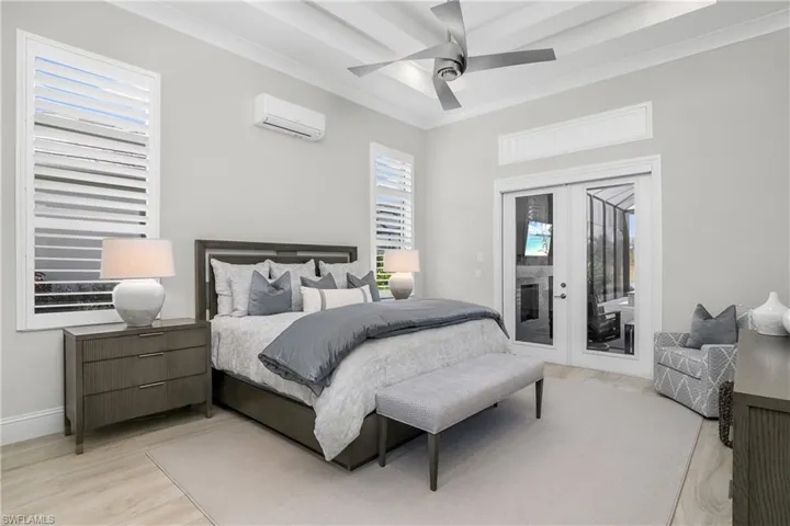 Owner suite is your own private oasis, featuring soaring ceilings, plantation shutters, additional mini-split AC for sleeping comfort, and FABULOUS views!