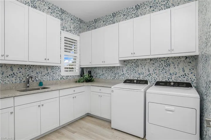 Wow! What a laundry room! You'll love all of the additional storage!