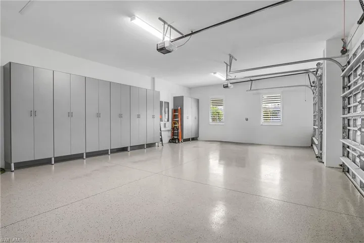 3 car garage is huge with a plethora of storage.