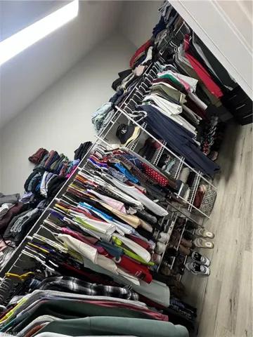 Custom closet system featuring white wire shelving