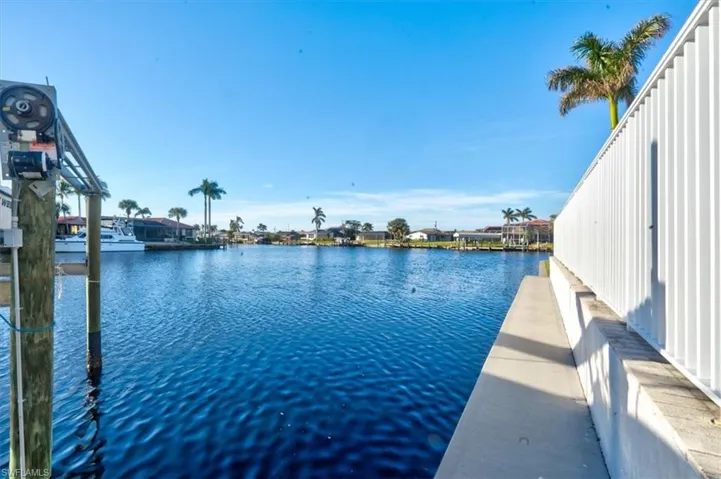 Property view of water with a boat dock
