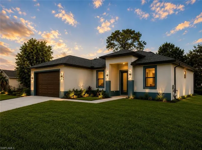 Contemporary single-story residence featuring a two-tone exterior, a dark-paneled garage door, and a covered entry