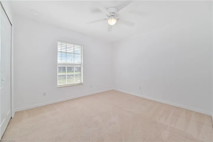 Guest bedroom featuring ceiling fan