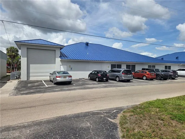 VIEW LOOKING NORTH, SHOWING ALLEY PARKING AND 12' X 14' GARAGE DOOR FOR STORAGE SPACE