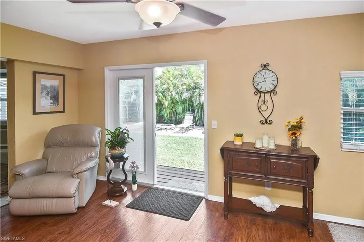 Entryway with a ceiling fan and wood finished floors