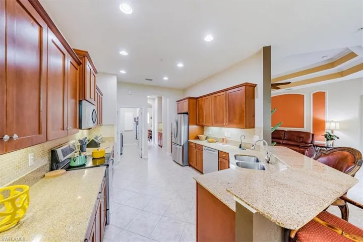 Wood cabinets, granite countertops and stainless steel appliances.