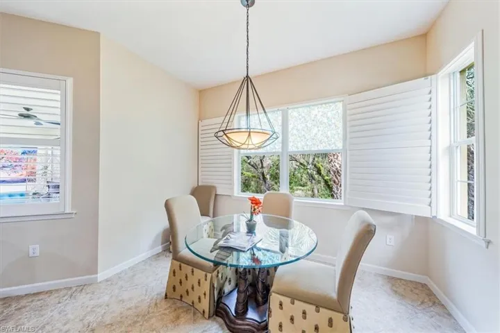 Light and bright mornings await in this cozy breakfast area.