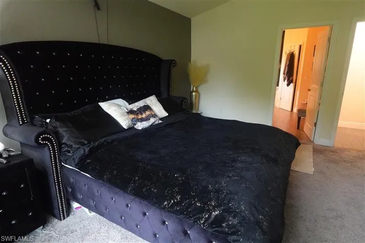 Bedroom featuring carpet