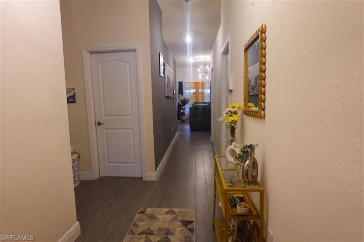 Hallway featuring dark hardwood / wood-style flooring