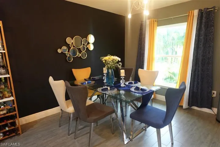 Dining room with hardwood / wood-style flooring