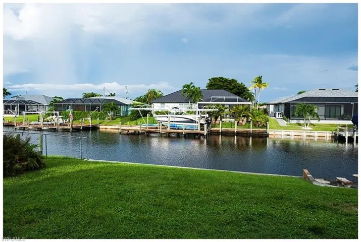 Property view of water featuring a boat dock