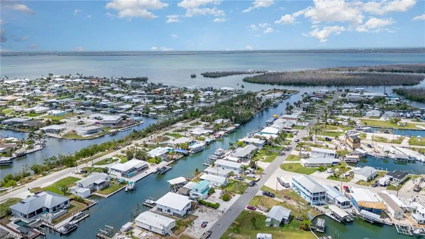 Aerial perspective of suburban area with a large body of water