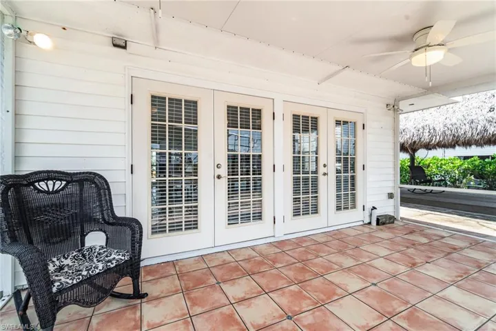 View of patio / terrace with french doors and ceiling fan