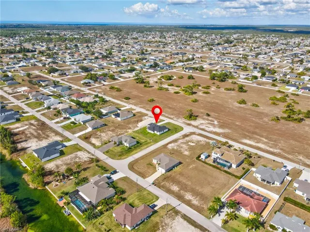 Aerial overview of property's location with nearby suburban area