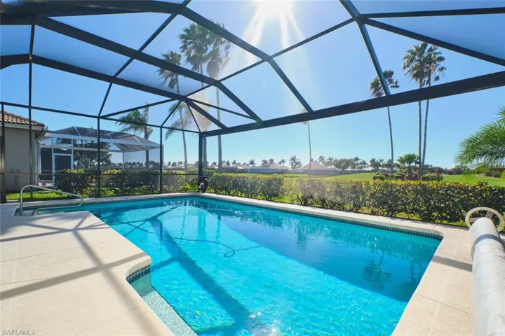 Outdoor pool with a sunroom, a lanai, and a patio area