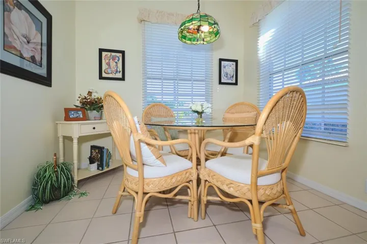 Dining space with plenty of natural light and light tile patterned floors