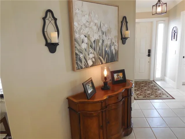 Entrance foyer featuring plenty of natural light and light tile patterned floors