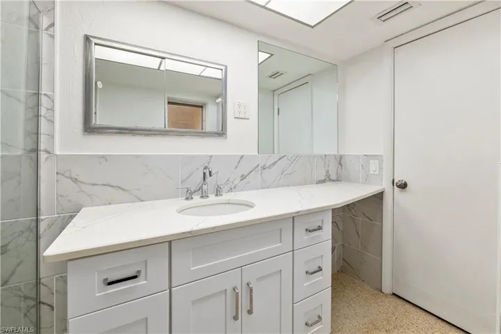 Modern vanity with an integrated sink,and ample under-sink storage