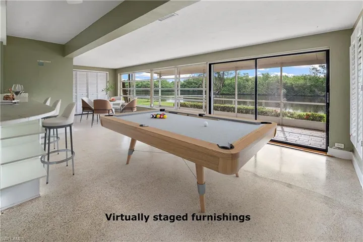VIRTUALLY STAGED Expansive room possible den W/ water view -