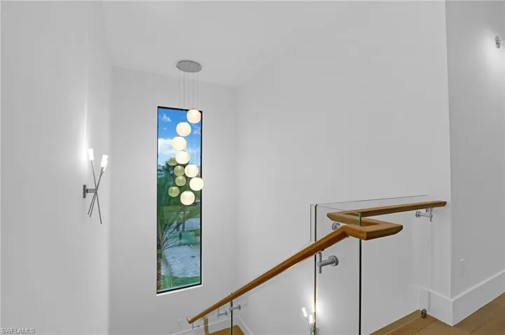 Staircase featuring baseboards
