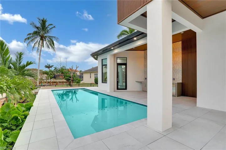Outdoor pool with a patio